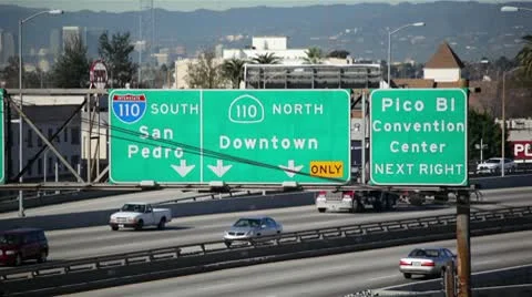 LA Freeway Sign With Traffic HD Stock Footage 10798438