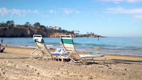 La Jolla Beach 4K Chairs Sitting By The Pacific Ocean Stock Footage