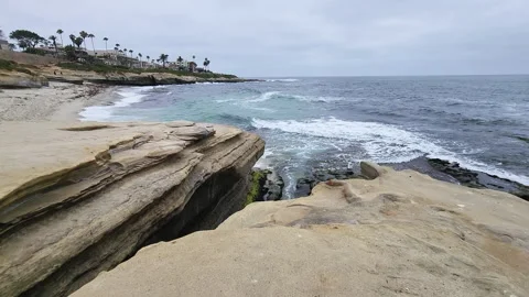La Jolla Beach cliff rocks and ocean waves Stock Footage 202054018