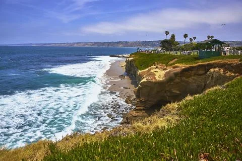 La Jolla Cliffs and Ocean Waves with Beach and Palm Trees in San Diego Cali.. Stock Photos