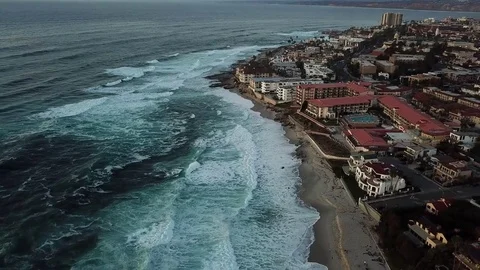 La Jolla coastline from hovering drone at sunset on a cloudy afternoon Stock Footage 84774815