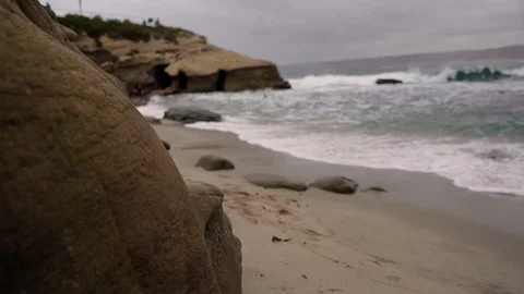 La Jolla Cove Rack Focus and Reveal Behind Rock on Beach Stock Footage 96038791