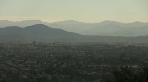 La jolla day high angle lookout point trees houses and mountains Stock Footage 44540822