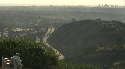 La jolla day high angle lookout point trees houses and mountains old women si Stock Footage 44546748