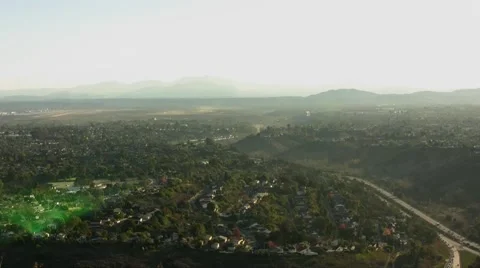 La jolla day time-lapse high angle highway mountains trees houses cars Stock Footage 44526442