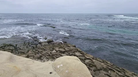 La Jolla rock pattern with potholes at the shore Stock-Footage 202053126
