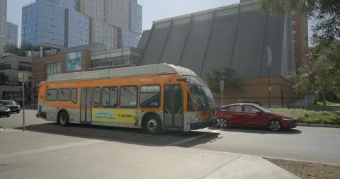 LA Metro bus passing in front of Colburn School of Music, Los Angeles Stock Footage 276448686