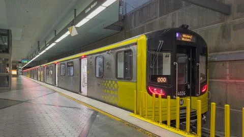 LA Metro D Line train with yellow front and details, stopped at Wilshire-Western Stock Photos