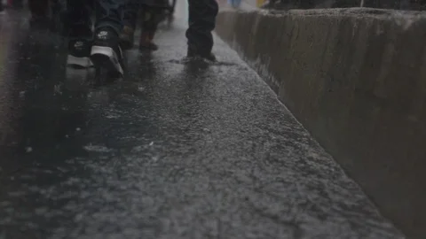 LA Package 1 | Crowd of people walking in rain (leg shot slow motion) Stock Footage 115159551