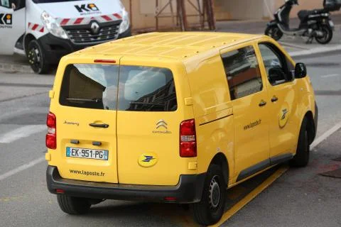 La Poste Yellow Parcel Delivery Van Parked In The Street Stock Photos