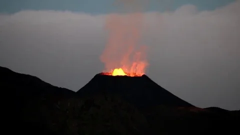 La Reunion Piton de la Fournaise volcano eruption at night with lavaflow Stock Footage 69086565