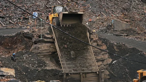 La Rinconada, Peru - March 5, 2026:Mining Loader Dumping Rocks for Ore Screening Stock Footage 345134635