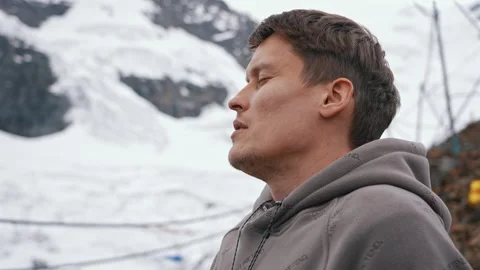 La Rinconada, Peru - March 5, 2026: Man Using Portable Oxygen Canister Mountains Stock Footage 345135209