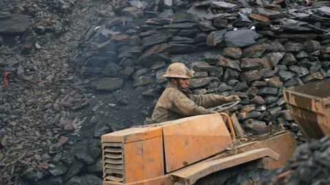 La Rinconada, Peru - March 5, 2026: Gold Miner Operating Heavy Machinery at Mine Stock Footage 345135444