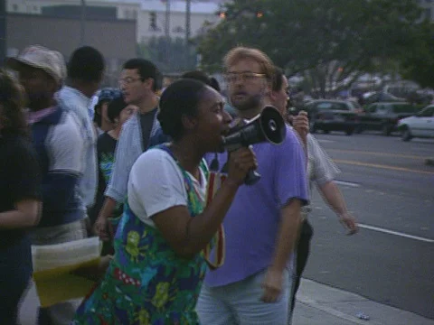 LA Riots 4-29-1992 Parker Center Daytime Protesters with signs and News Vans Stock Footage 75286544