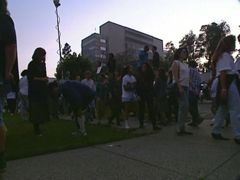 LA Riots 4-29-1992 Parker Center Daytime Protesters with signs and News Vans Stock Footage 75286751