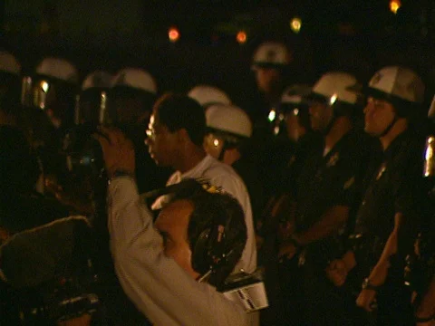 LA Riots 4-29-1992 Parker Center Protest Leader Urges Calm with his hands Stock Footage 78173616