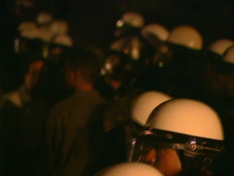 LA Riots 4-29-1992 Parker Center CU Police Helmets Pan to Protesters Stock Footage 78201305