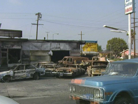 LA Riots 5-1-1992  Burned Out Cars and Building in South Central Los Angeles Stock Footage 78242702