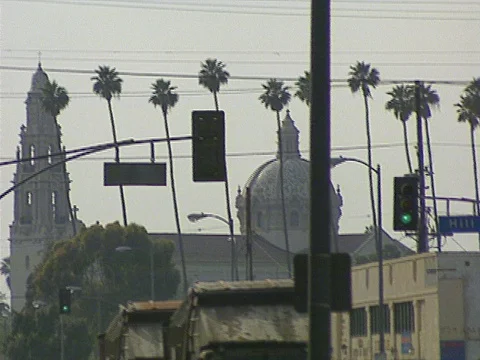 LA Riots 5-1-1992 Two trash trucks driving thru South Central Los Angeles Stock Footage 78244915