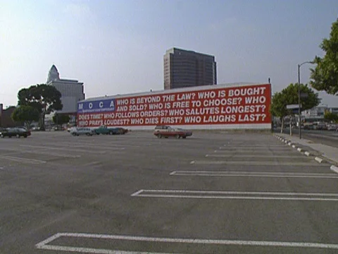 LA Riots 5-1-1992, Downtown Los Angeles MOCA "Who is Beyond the Law Mural" Stock Footage 78245327