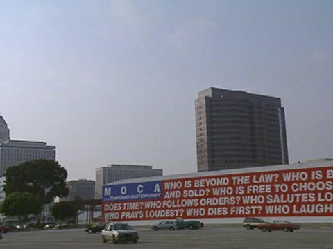 LA Riots 5-1-1992, Downtown Los Angeles MOCA "Who is Beyond the Law Mural" Stock Footage 78245342