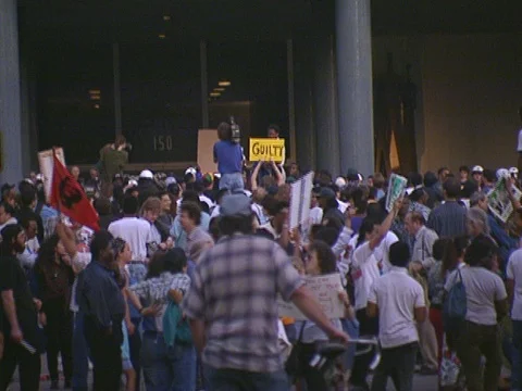 LA Riots Protesters with Guilty Sign on Parker Center Lawn Stock Footage 75286128
