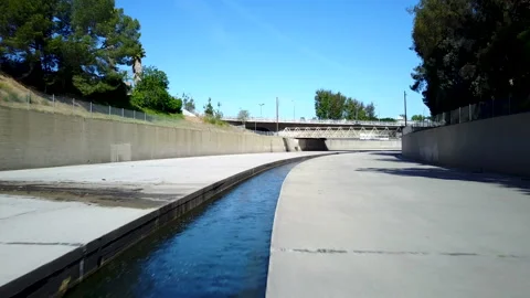 LA River Under Bridge and Rise. 4k Aerial Stock Footage 145560407