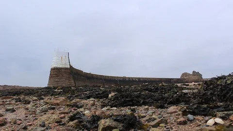 La Rocque pier Jersey at low tide Stock Footage 129774037