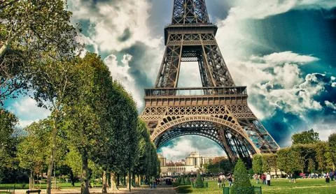 La Tour Eiffel, Paris. Tower sunset view with Champs de Mars gardens Stock Photos