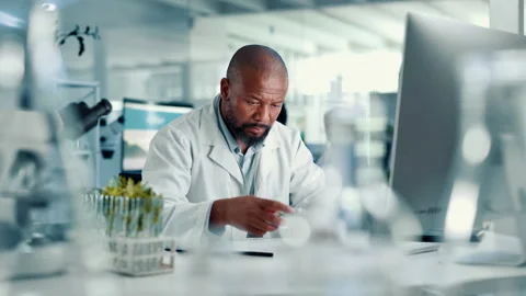 Lab, analysis and man with computer, plants and medical research for disease Stock Footage 310600917