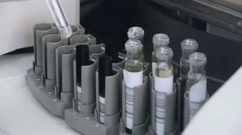 Lab Assistant loading test tubes for research Stock Footage 12363388