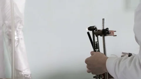 The lab assistant sets the burner on fire. Man prepare for laboratory work with Stock Footage 73685544