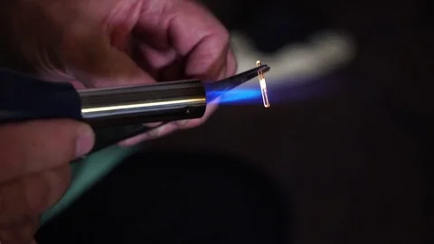 Lab assistant sets the burner on fire. Man prepare for laboratory work with fire Stock Footage 81702949