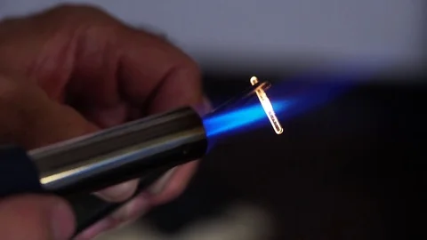 Lab assistant sets the burner on fire. Man prepare for laboratory work with fire Stock Footage 81702977