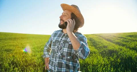 Lab caucasian worker engineer in hat inspecting eco growing plantations and Stock Photos