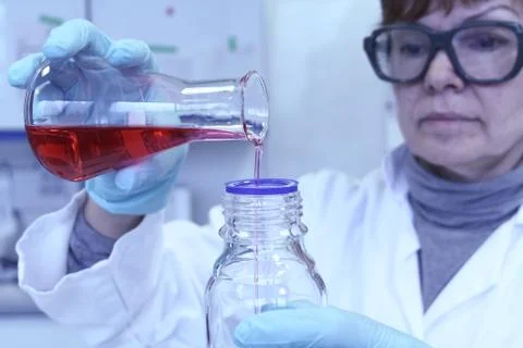 Lab chemist forgets red liquid from test tube Stock Photos