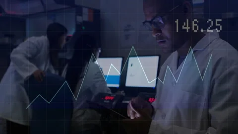 Lab colleagues adjusting tablet and panel, displaying line graph overlay in Vidéo 309108253