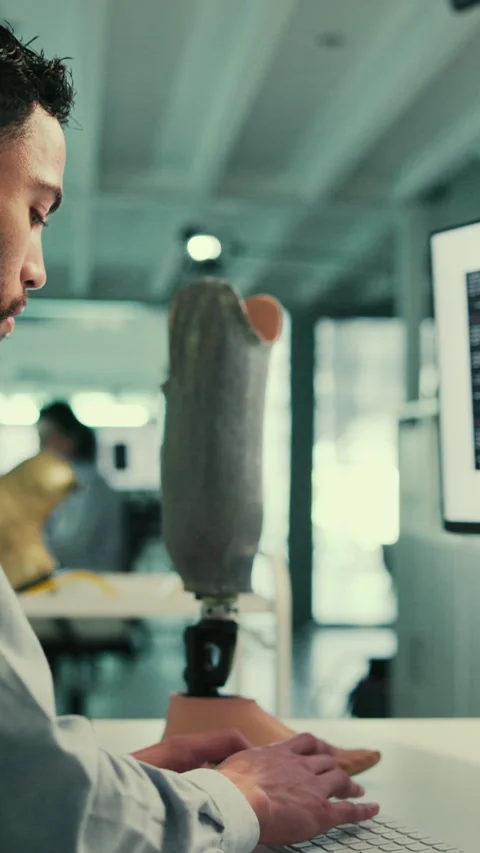 Lab, computer and man with artificial limb for research, innovation and design Stock Footage 332902628