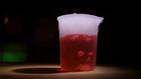 Lab - Dark Red Bubbly Beaker Stock Footage 77764132