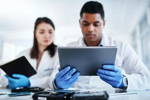 Lab, engineer and hands with tablet, repairing and collaboration for project Foto stock