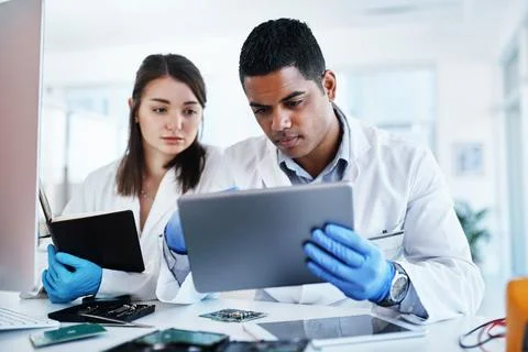 Lab, engineer and people with tablet, serious and collaboration for project Foto stock
