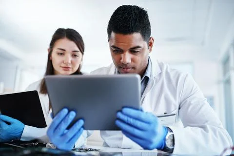 Lab, engineer and people with tablet, happy and collaboration for project Foto stock