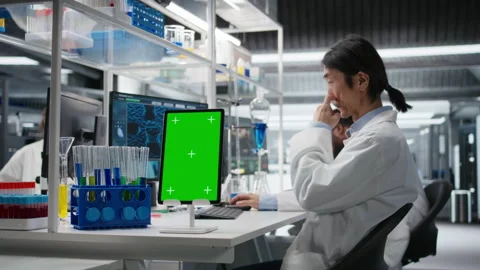 Lab engineer using isolated screen tablet for DNA data analysis Stock Footage 320143925