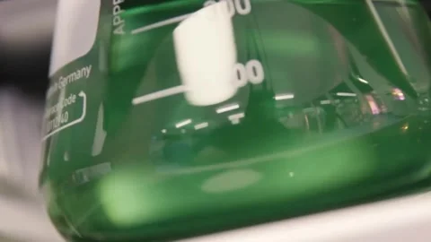 Lab experiment in glass flask Stock Footage 275350116
