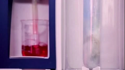 Lab experiment in glass flask Stock Footage 276159759
