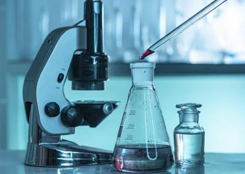 Lab glassware microscope arrangement Stock Photos