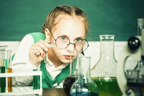 Lab microscope and testing tubes. My chemistry experiment. Back to school and Stock Photos
