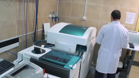 Lab Operator conduct blood sample test Stock Footage 123719691