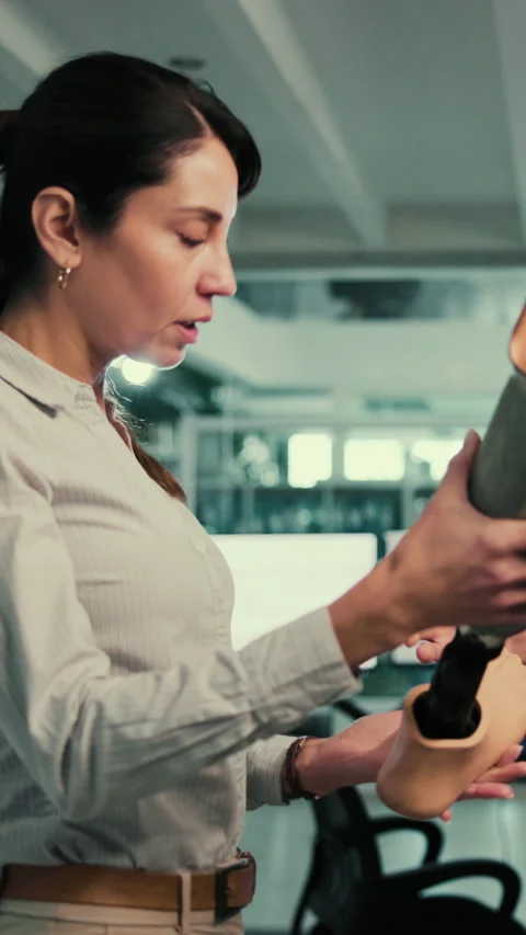 Lab, planning and people with prosthetic leg for research, solution and design Stock Footage 332914566